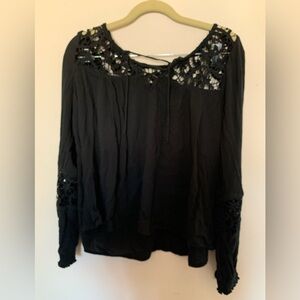 Long sleeve black blouse.